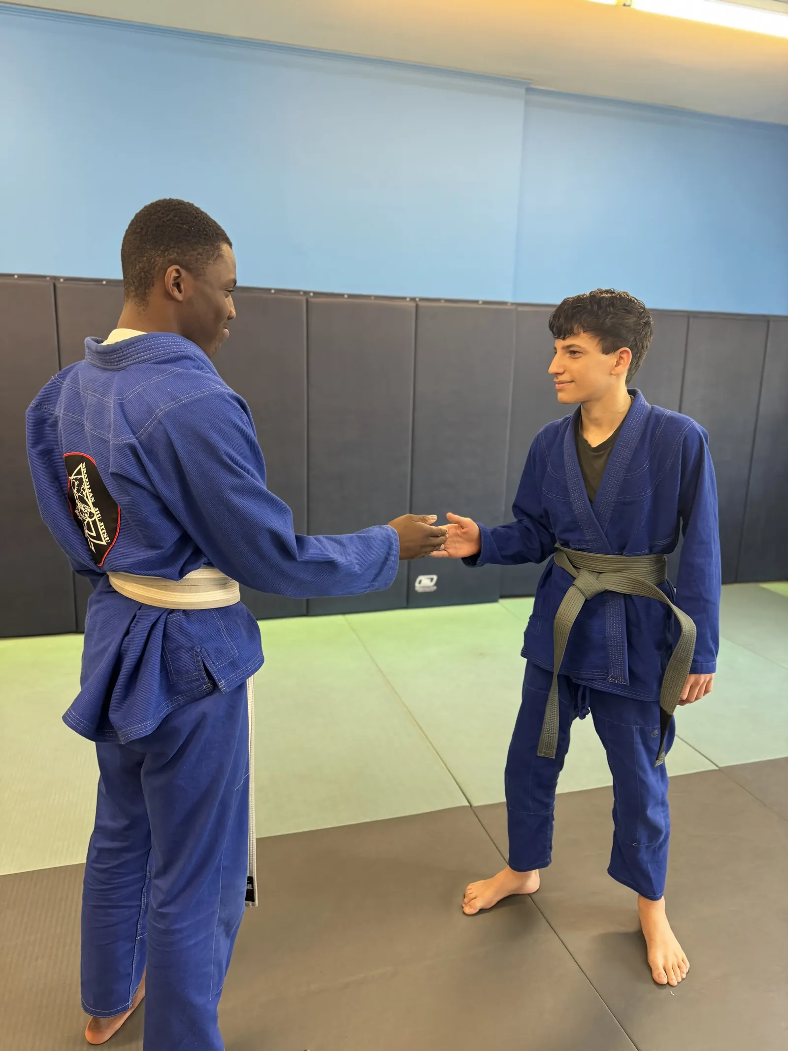 Coach Tyrone Elijah drilling hand-fighting grips with an adult student in Union, New Jersey